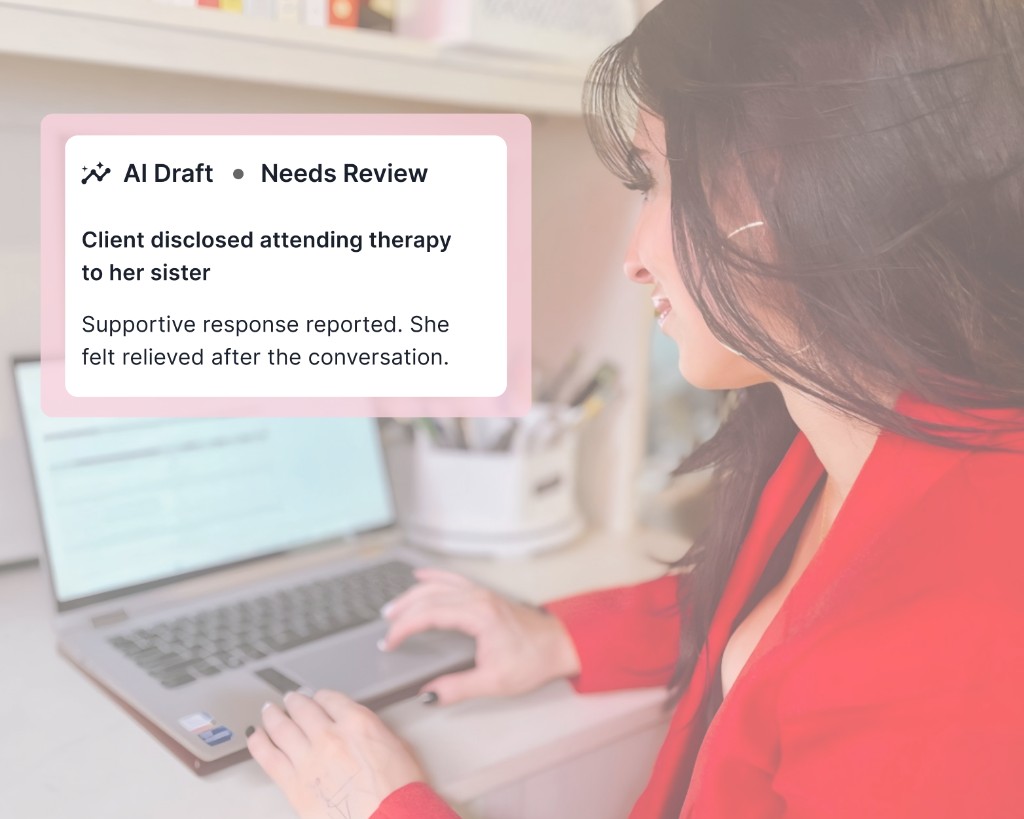 Therapist reviewing an AI-generated note on her laptop